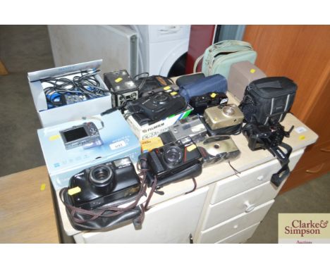 A quantity of various cameras to include a Cannon digital camera