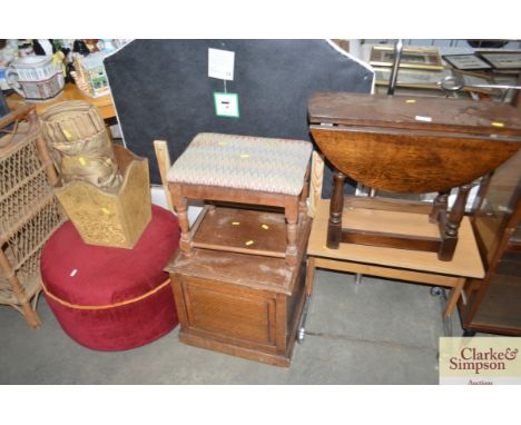 A small drop leaf table; an oak commode; an upholstered stool; a red upholstered pouffe etc. 