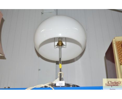 A modern table lamp with milk glass shade