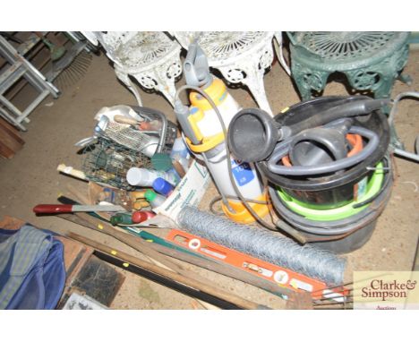 A box of various hand tools; a quantity of long handled gardening tools; various plastic buckets and funnels; and a sprayer 