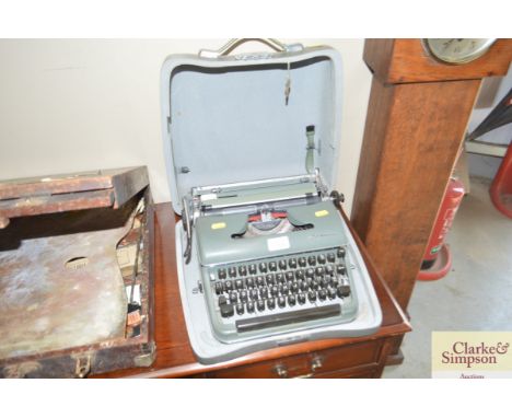 An Olympia typewriter in fitted case