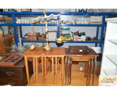 A nest of three occasional tables; a nest of teak drop leaf tables and a set of balance scales