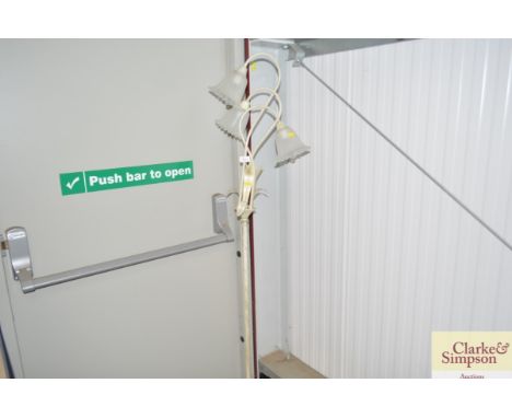 A three branch standard lamp with glass shade