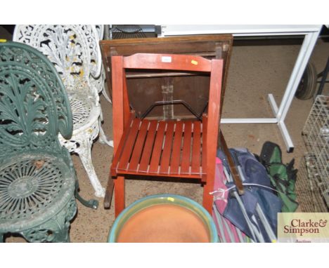 A folding chair and a card table