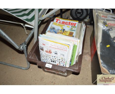 A box containing editions of Tractor magazine 