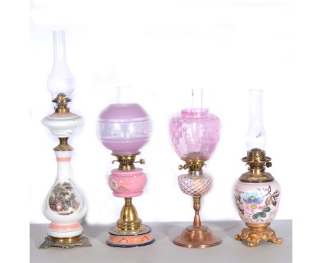 Four oil lamps, to include Hink's No.1, pink and clear glass banded globe with floral decoration, pink reservoir with hand-pa