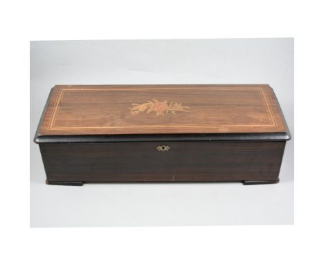 A Swiss mechanical musical box, steel comb, the 11inch drum playing twelve airs, stained wood case with inlaid rosewood lid, 