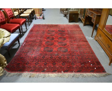 Bokhara carpet, two rows of five elephant foot guls on a red field, multi-bordered, 300cm x 209cm.