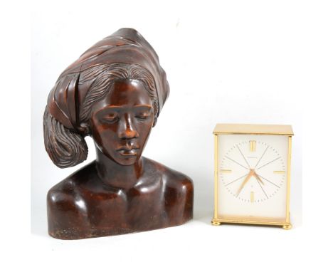 A Garrard eight-day desk clock, carved wooden female bust, brass jam pan, toasting fork and a carpet beater.