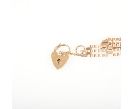 A 9 carat yellow gold three bar gate link bracelet with padlock fastener, crimped links, overall width 8mm, approximate weigh