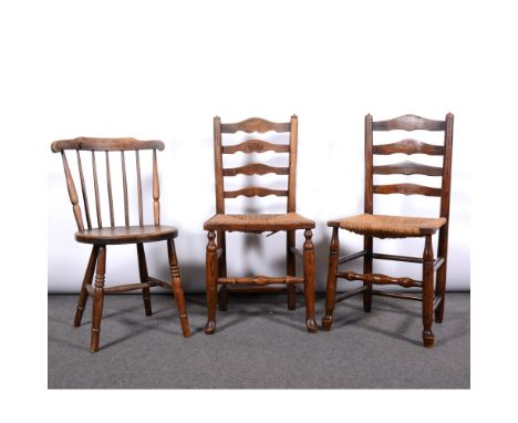 Two ash and stained wood ladder-back dining chairs, with rush seats, 92cm and 89cm; and an elm and beechwood comb-back dining