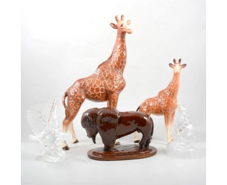 Melba ware pottery model of a Giraffe, 43cm, another similar, 30cm, a treacle glazed pottery model of a buffalo fixed on a wo