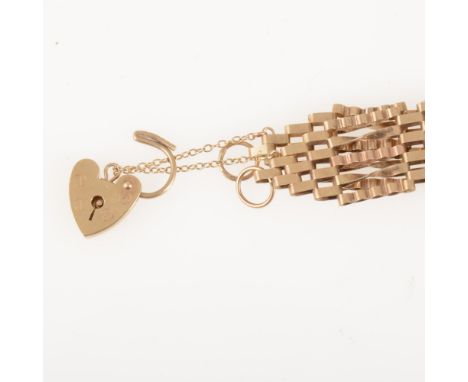 A 9 carat yellow gold five bar gate link bracelet with padlock fastener, twisted and crimped links, overall width 15mm, appro