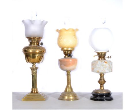 Three oil lamps, to include Hink's &amp; Sons, almost opaque shade, brass reservoir with fluted top, corinthian-style column,