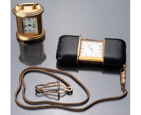 Fun travel alarm clock, slide model, gilded bronze mechanism set between two rigid leather covers. Chain of suspension. In wo