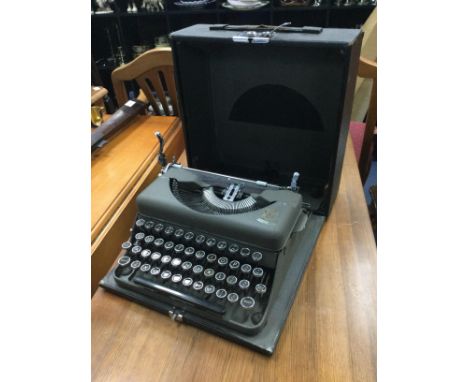PORTABLE TYPEWRITER, along with a wall mirror and a leather suitcase (3)