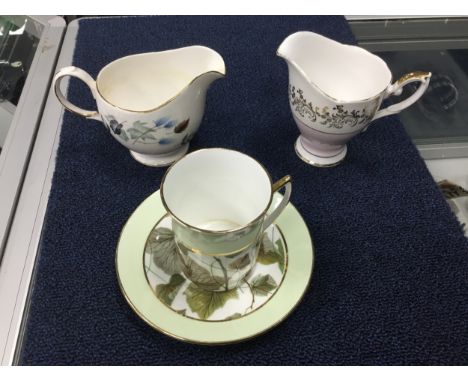COLCLOUGH TEA SERVICE, decorated with leaves on a white ground, comprising seven cups, six saucers, six side plates and cream