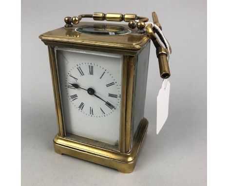 EARLY 20TH CENTURY BRASS CARRIAGE CLOCK, with key, 12cm high