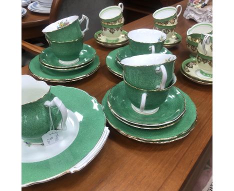 COALPORT PART TEA SERVICE, decorated with flowers, comprising five cups, six saucers, six plates and a sandwich plate, along 