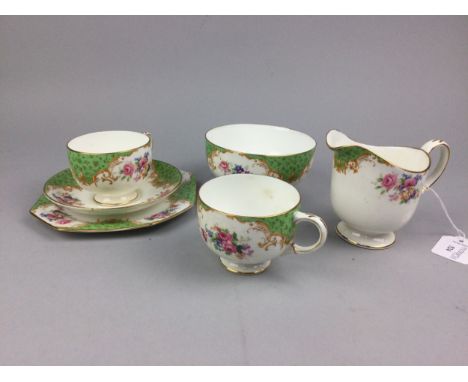 PARAGON TEA SERVICE, decorated with pink roses and other flowers comprising eleven teacups, twelve saucers and sideplates, a 