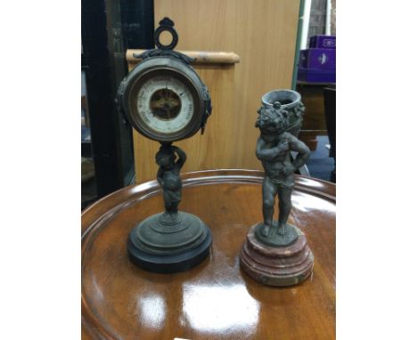 EARLY 20TH CENTURY BRONZED TABLE BAROMETER, on support modelled as a cherub, 26cm high, along with bronzed figures, candlesti