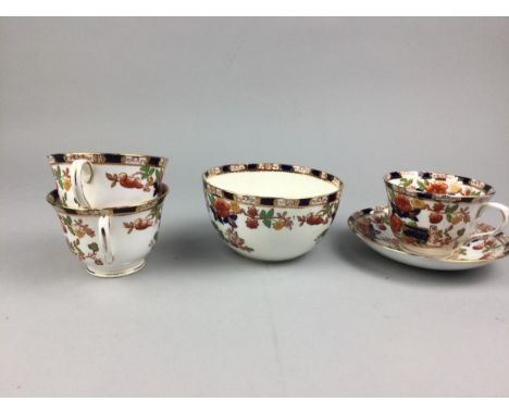 EARLY 20TH CENTURY TEA SERVICE, decorated with flowers in shades of red, blue and green, comprising twelve sideplates, saucer