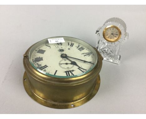 SHIP'S BULKHEAD CLOCK, 18cm diameter, along with a crystal mantel clock (2)