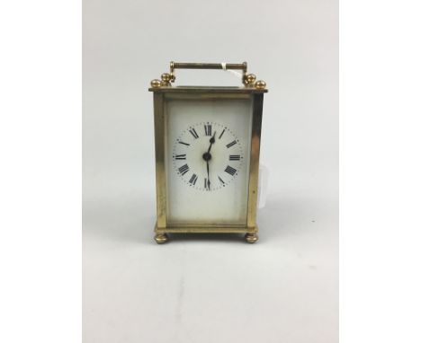 BRASS CARRIAGE CLOCK, with white enamel dial, 11cm high