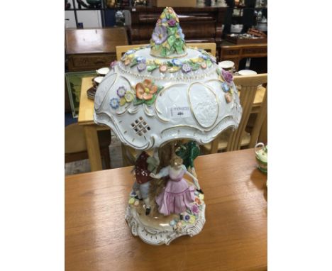 CONTINENTAL CERAMIC TABLE LAMP, modelled in relief with four dancing figures, and with floral decoration in relief, 57cm high