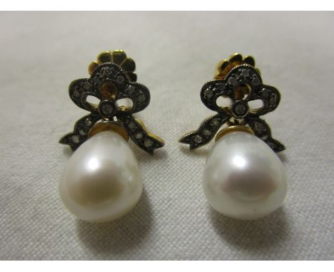 Pair of pearl and diamond bow earrings