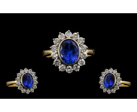 18ct Gold and Platinum Superb Quality - Blue Tanzanite and Diamond Set Cluster Ring. The Oval Faceted Blue Tanzanite of Wonde