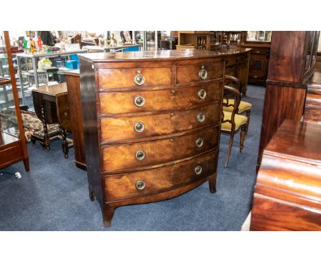 A Late Regency Period/ Georgian Large Bow Fronted Mahogany Chest with graduating drawers. With brass roundel loop drop handle