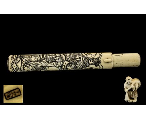 Japanese Antique Ivory Scroll Case carved to the body with figures, with belt buckle.  8.5" long, along with an Ivory Netsuke