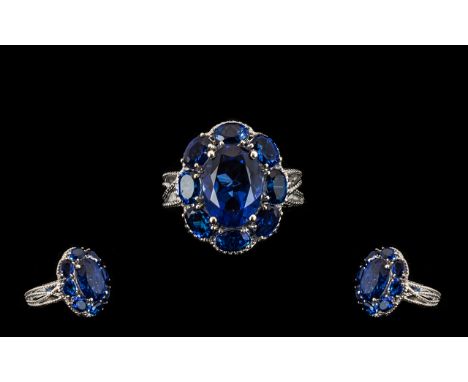 Ceylon Blue Coloured Quartz Cluster Ring, 10.25cts; a statement ring comprising a 6ct oval cut Ceylon blue coloured quartz, s