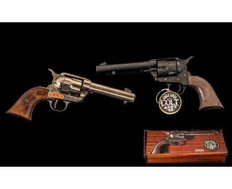 Two Replica Pistols one boxed (actual size) Colt Army .45.  Also, Madera Bois Holz.  Please see images.