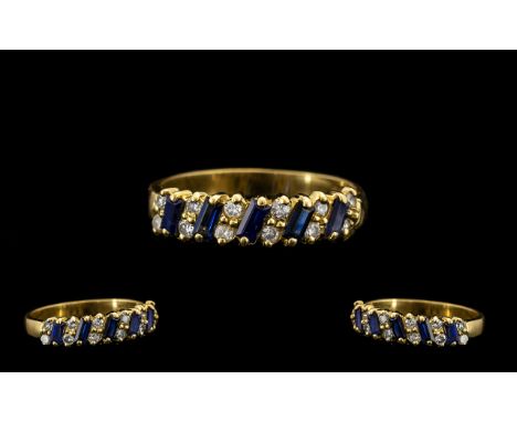 18ct Gold Nice Quality Sapphire and Diamond Dress Ring - the step cut sapphires with diamond spacers both of good colour and 