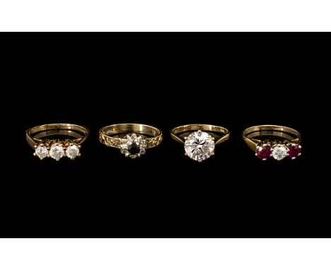 Collection Of Four 9ct Gold Rings, Single Stone CZ Solitaire, Three Stone CZ Ring, Three Stone Dress Ring And a Sapphire And 