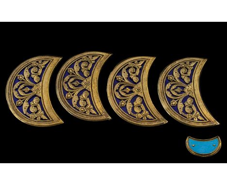 A Set of Four Antique Crescent Shaped Arabesque Bosses finely cast with floral decoration inlaid on blue enamel. Probably Tur