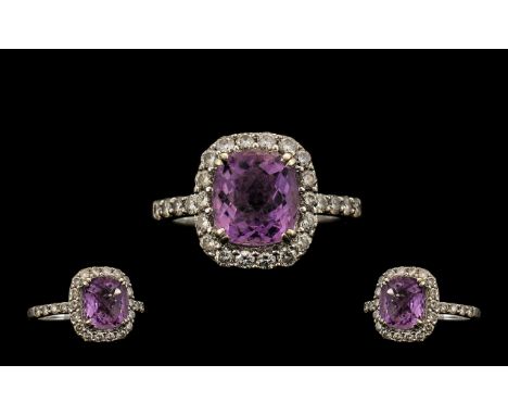 Stunning 18ct White Gold, Amethyst &amp; Diamond Set Dress Ring.  Interior of shank Marked 18ct, the central faceted amethyst