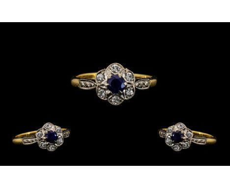 Attractive 18 ct Gold and Platinum Diamond and Sapphire Set Ring - Flowerhead design. Marked 18 ct and Platinum. Diamond of g