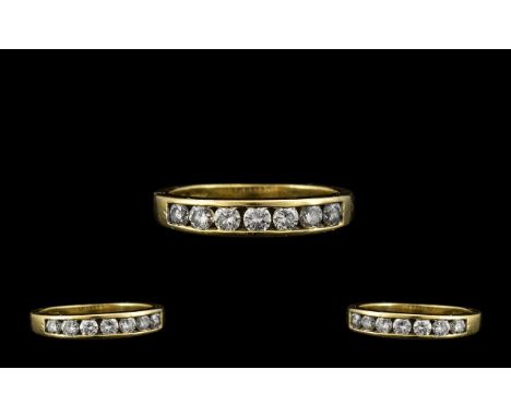 18ct Gold - Attractive Channel Set Seven Stone Diamond Ring, The Round Brilliant Cut Diamonds of Good Colour and Clarity. Est