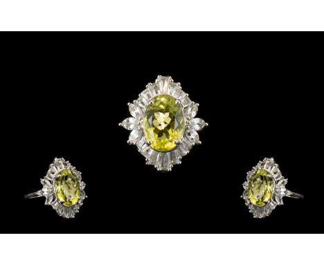 Ouro Verde Quartz and Topaz Statement Ring, an oval cut natural green gold quartz of 6cts, framed with a deep halo of white t
