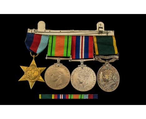 WW2 Group Of Four Medals To Include 1939-45 Star, Defence &amp; War Medal And George VI Territorial Efficiency Medal, Awarded