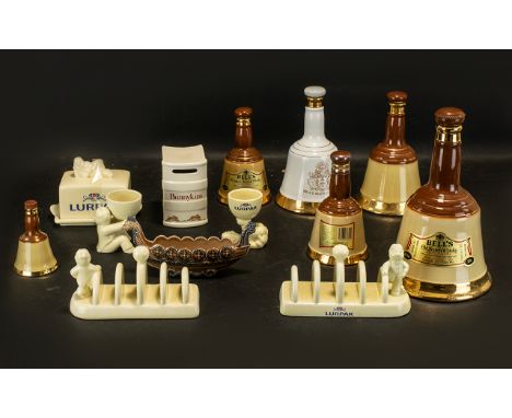 Collection of Bell's Wade Whiskey Decanters, six in total, various sizes.  Also, two Lurpak toast racks, a Lurpak butter dish