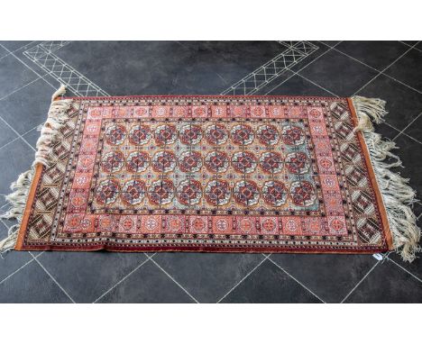 Persian Carpet, extremely fine quality, with a Tekke design to the central panel, vibrant colour.  84'' length, 48'' width.