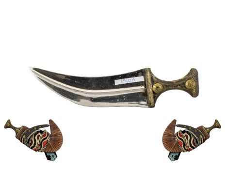 Middle Eastern Dagger &amp; Sheath of typical Arab shape and design.  The hilt in brass with creased leather scabbard design,