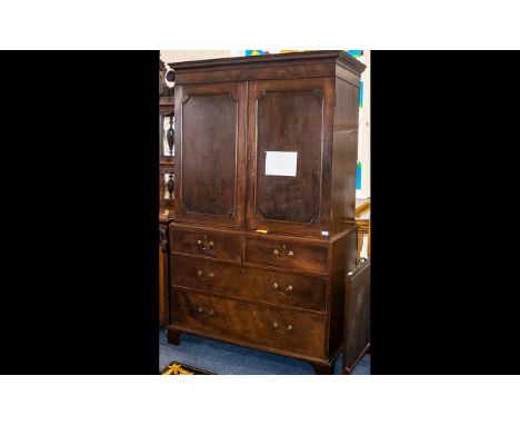 Georgian Mahogany Linen Press with a cupboard top, with sliding shelves to the interior, with a chest of graduated drawers be