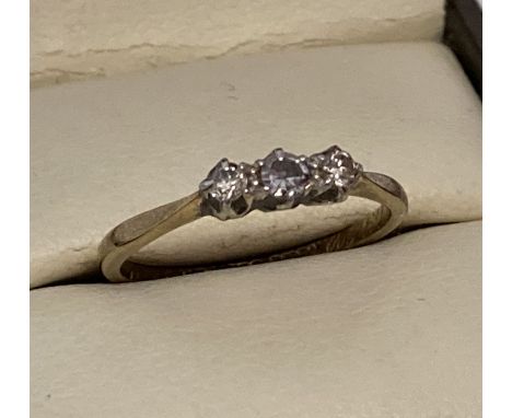 A vintage 9ct gold and platinum trilogy diamond ring. Approx. diamonds .15ct. Inscription engraved to inside of band "M.M.N x