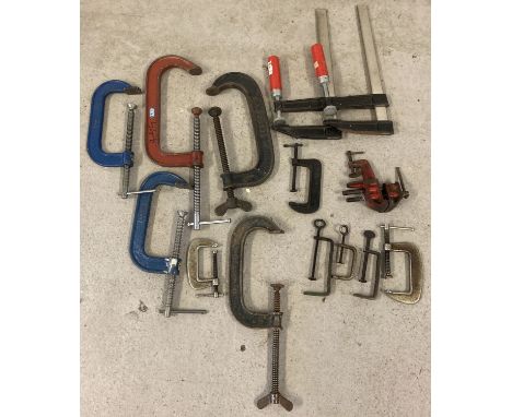 A collection of vintage G-Clamps in varying sizes to include examples by Record. Together with a table top engineers vice. 