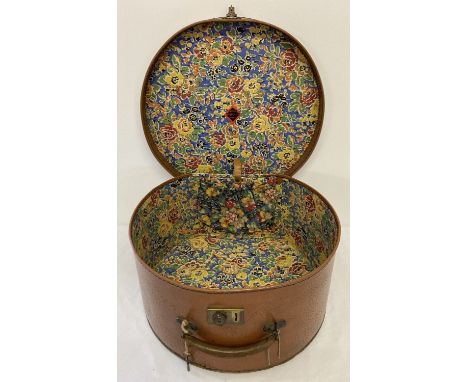 A large vintage  Genuine Vulkolite Fibre vanity case complete with key. Floral decoration to interior with one elasticated po